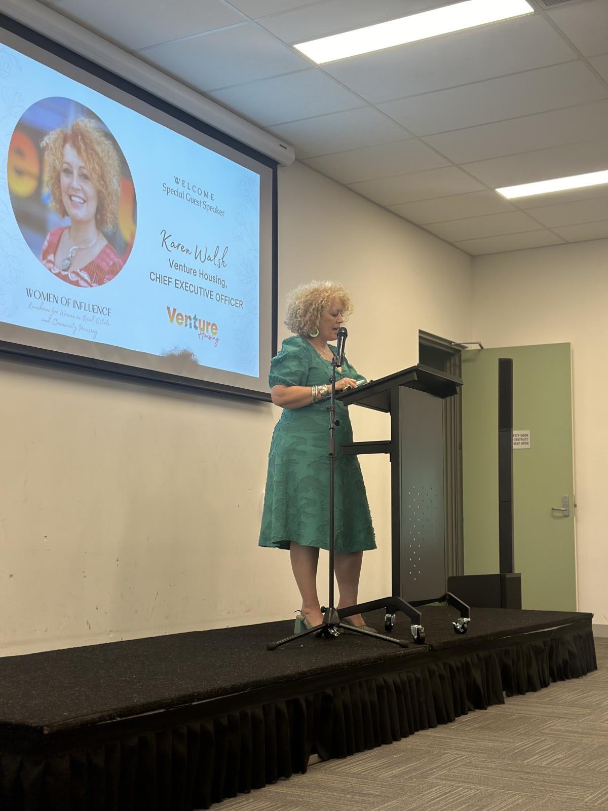 Venture CEO Karen Walsh presents at the REINT International Women's Day Luncheon