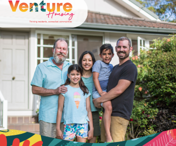 Three generation diverse family in front of a house smiling, new Venture Housing branding with greens, pinks yellows and reds representing the vibrancy of the Territory