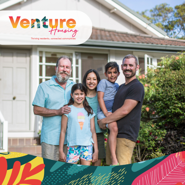 Three generation diverse family in front of a house smiling, new Venture Housing branding with greens, pinks yellows and reds representing the vibrancy of the Territory